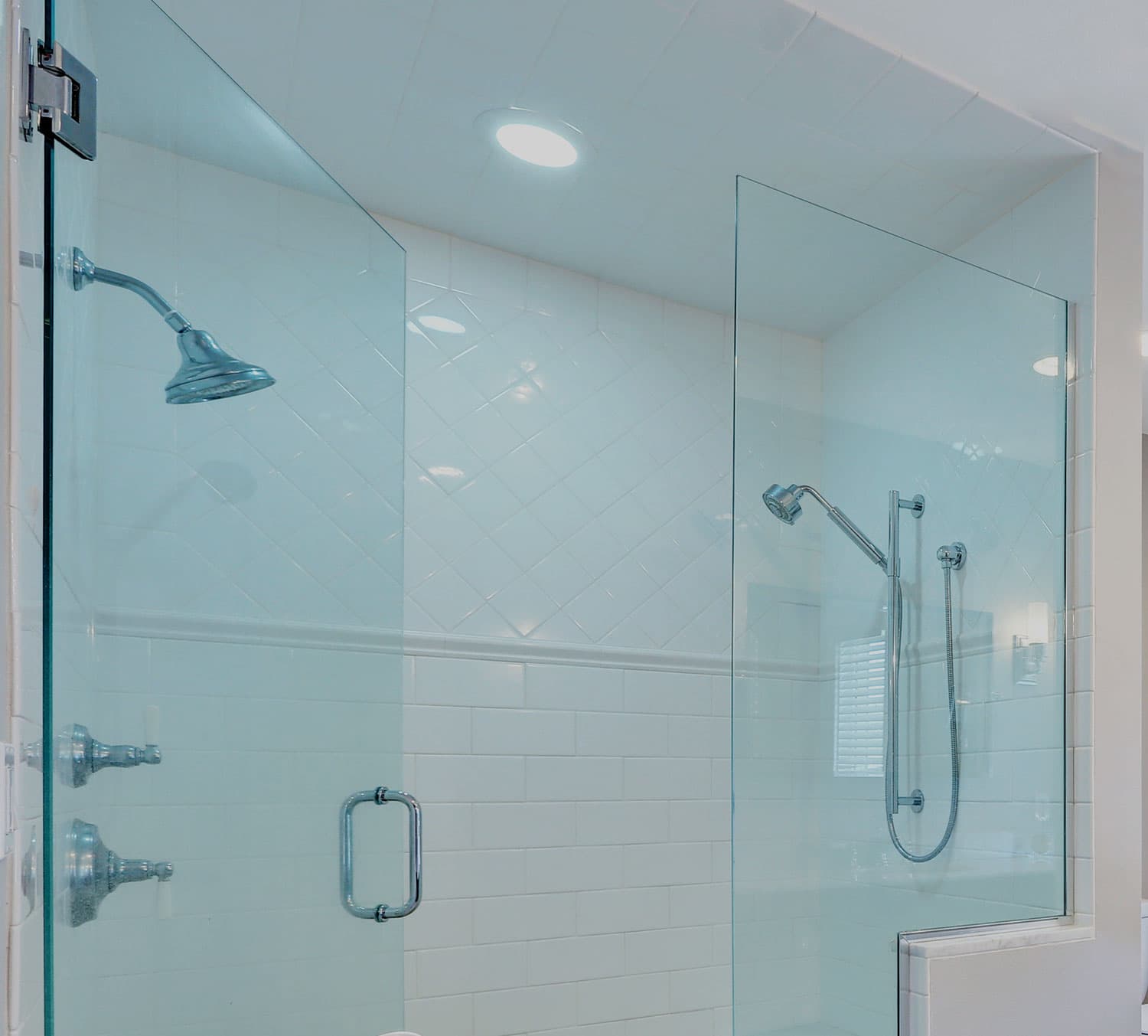 Walk-in glass shower with subway and diamond tiling by RB Thomas